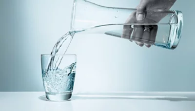water being pured into a drinking glass