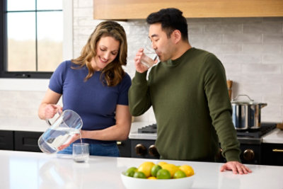Couple Pouring Water Pitcher- High End Residential Lifestyle Photoshoot